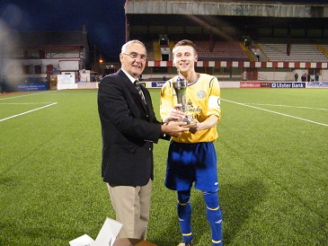 St Pats Captain Francis Cunningham  receiving the Cochrane Corry Cup from League Vice Chairman Mr Terry Pateman